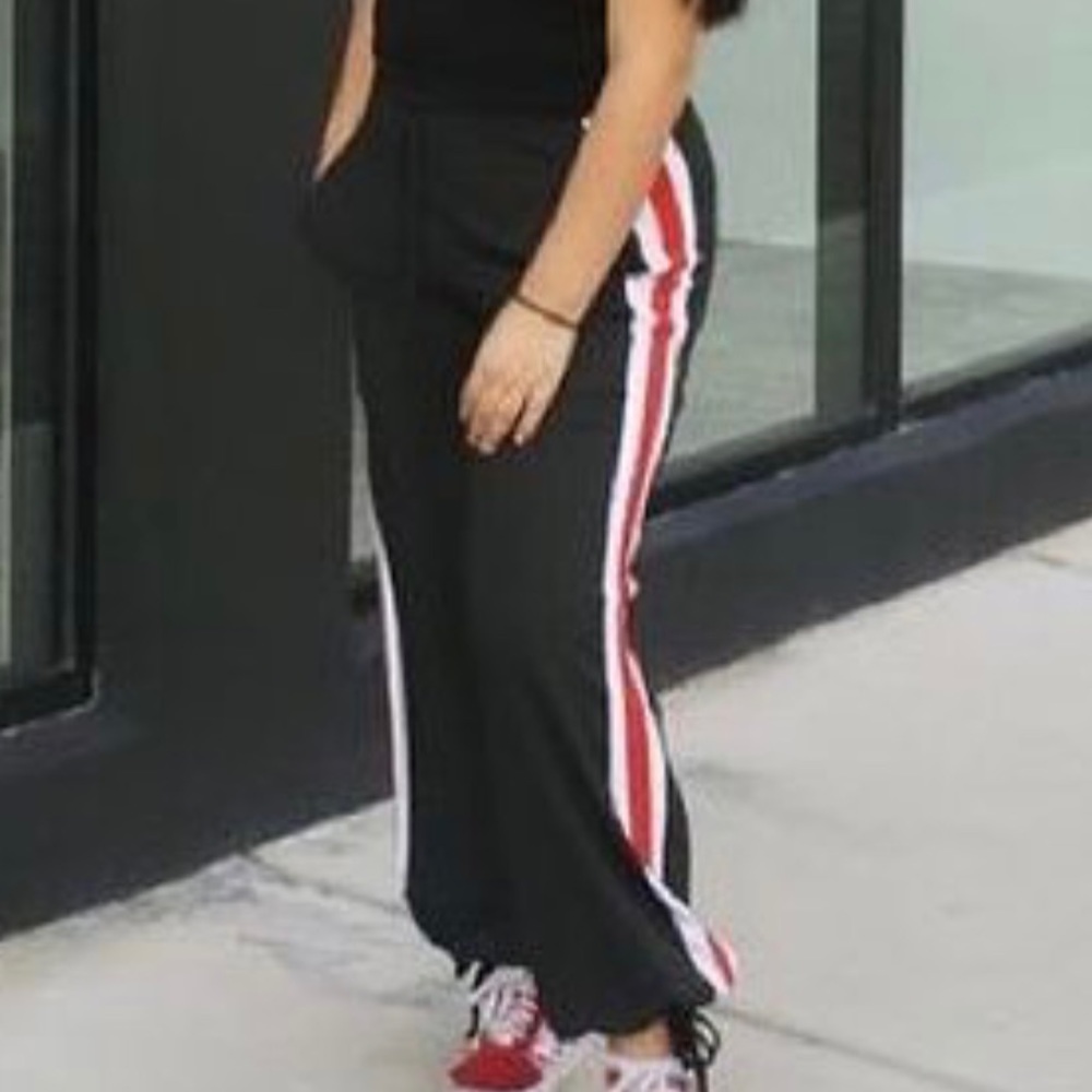 Black pants w/ white and red stripes on the sides